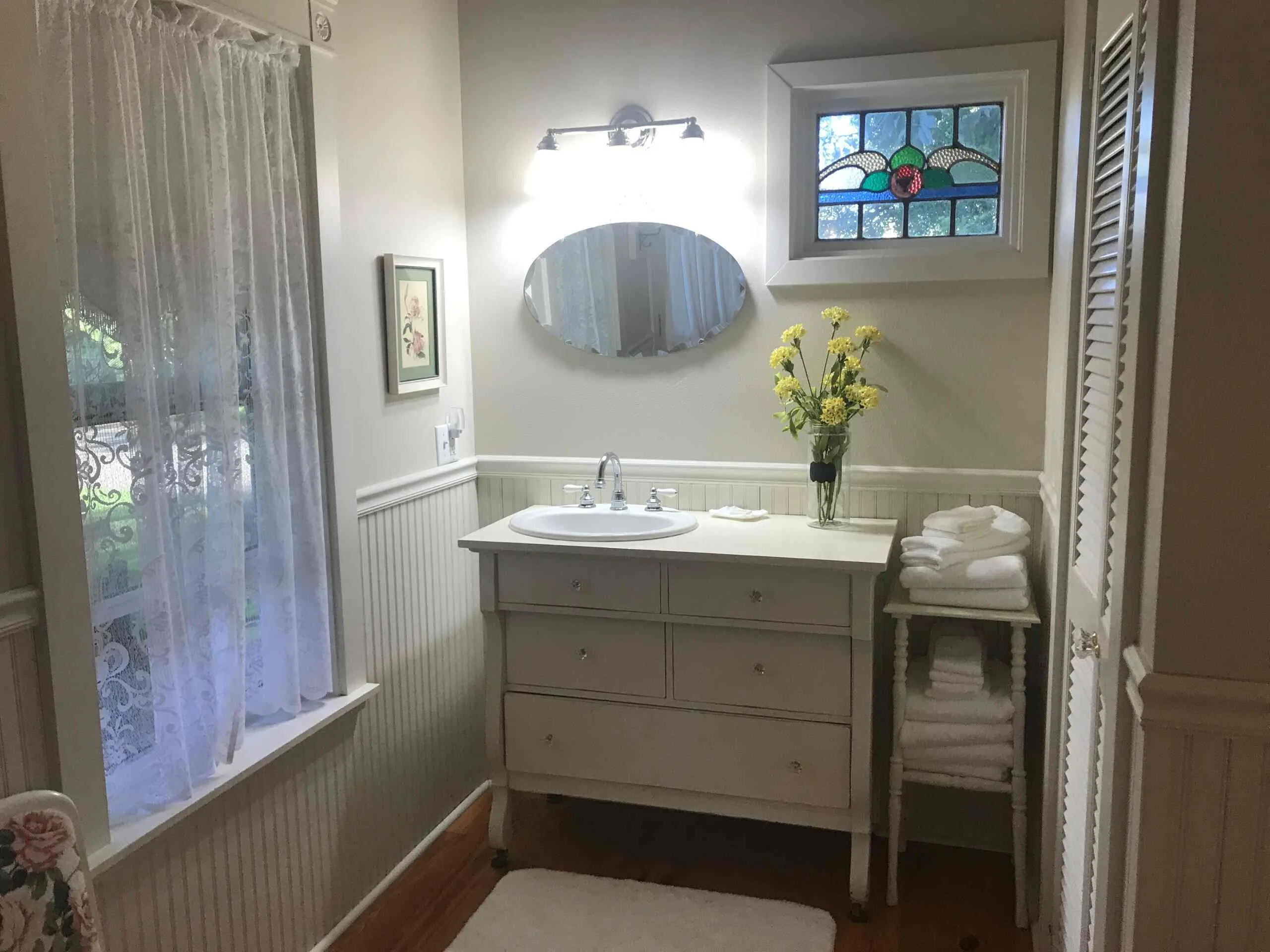 Vanity with antique mirror and stained glass